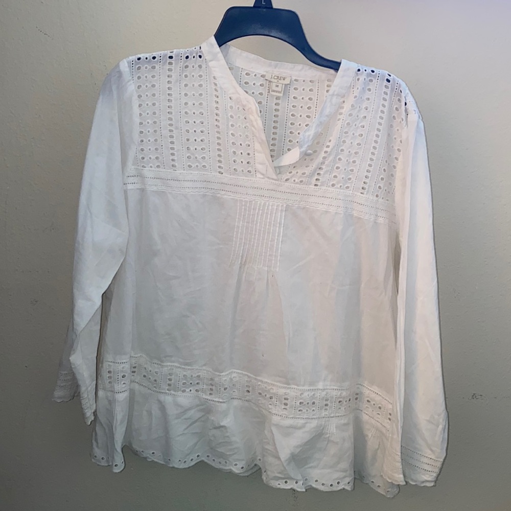 J Crew. White blouse with buttons on top.